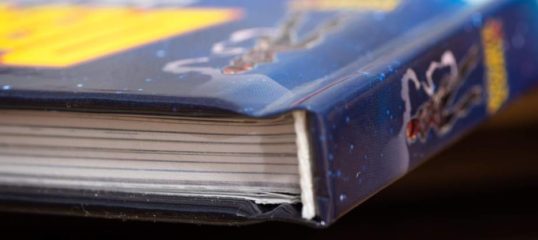 Hardcover books have a thick cover that is made from a board paper and wrapped with a custom printed graphic or book binding cover material like linen or leather
